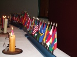 The table of candles and member countries represented from the 2006 ceremony.
